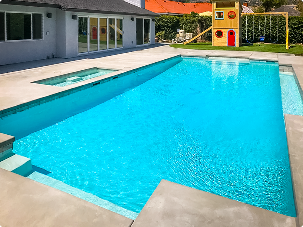 A household backyard swimming pool newly remodeled by The Pool Pro.