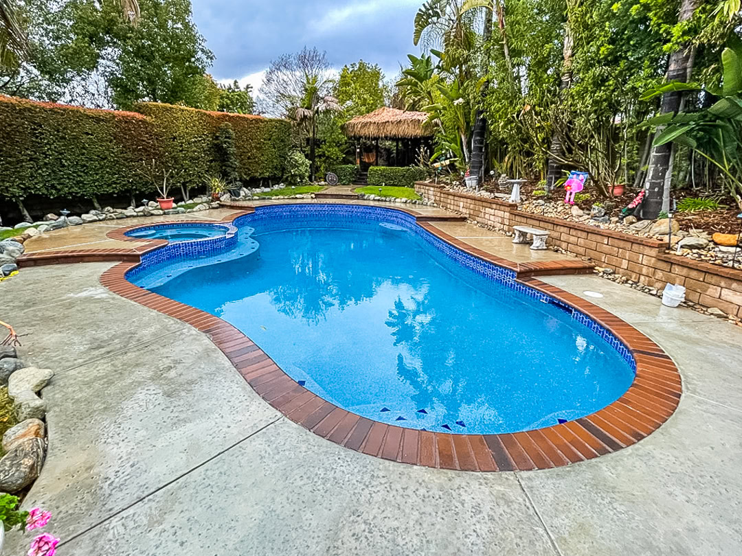 A swimming pool remodel by The Pool Pro. Pebble finish, cleaned existing tile.