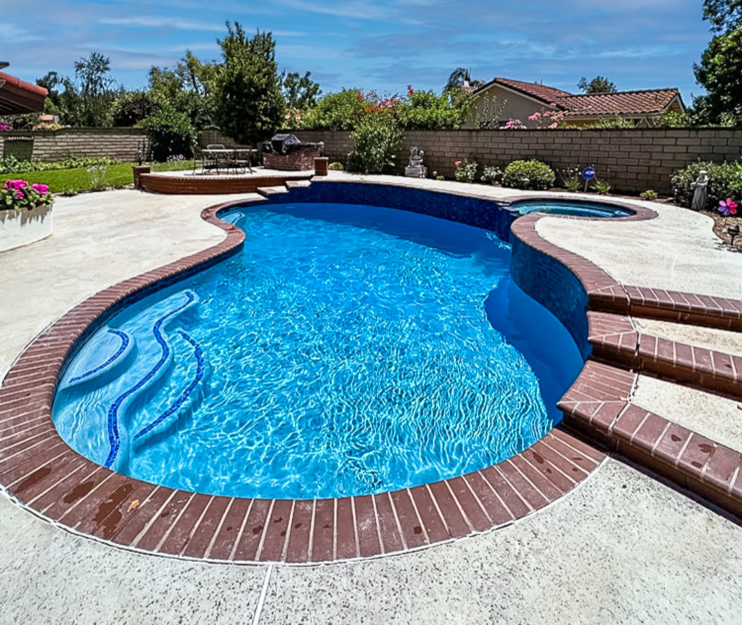 Pool remodel by The Pool Pro. Pebble finish, new tile.