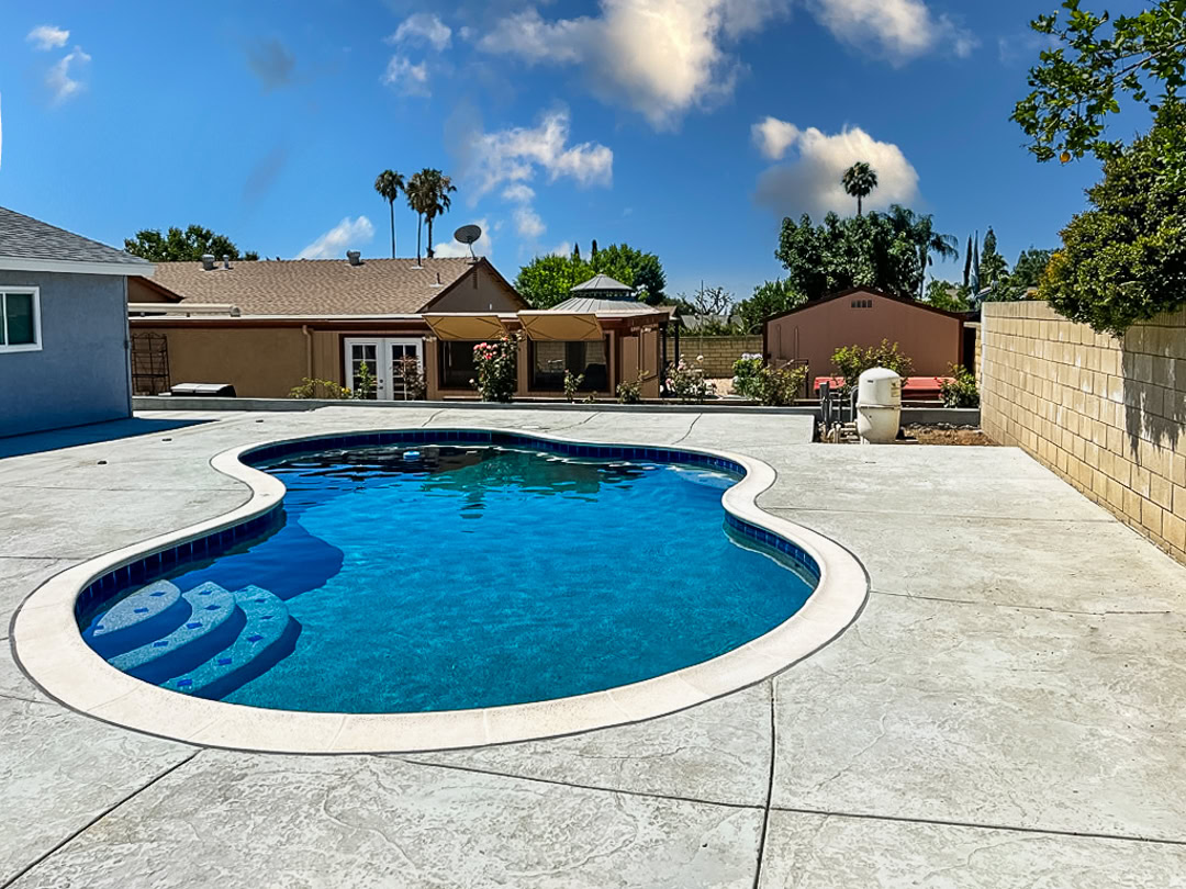 Pool remodel by The Pool Pro. Pebble finish, new tile, new coping, new skimmer, new autofill, new vacuum line.