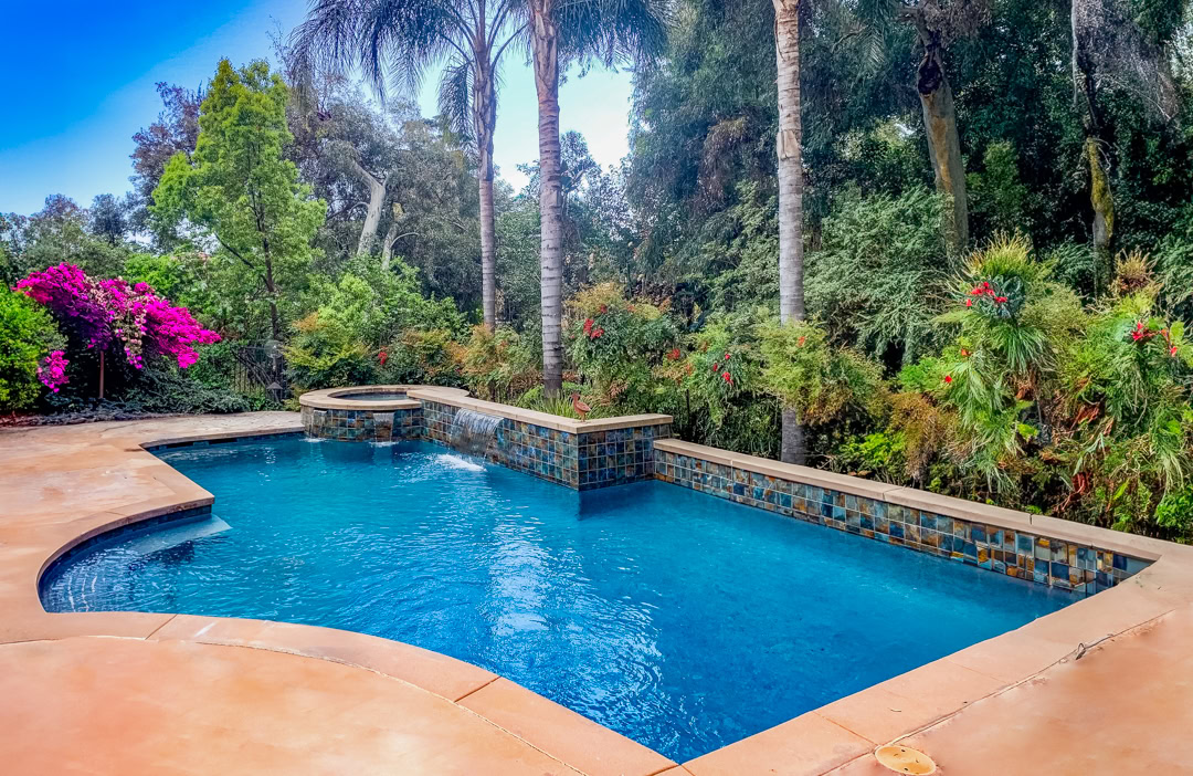 A swimming pool remodel by The Pool Pro. Pebble finish, new tile.