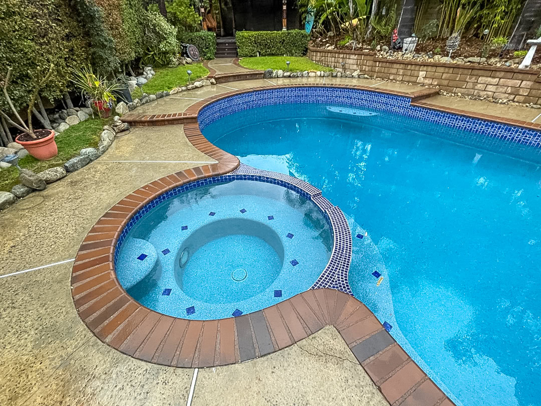 A swimming pool remodel by The Pool Pro. Pebble finish, cleaned existing tile.